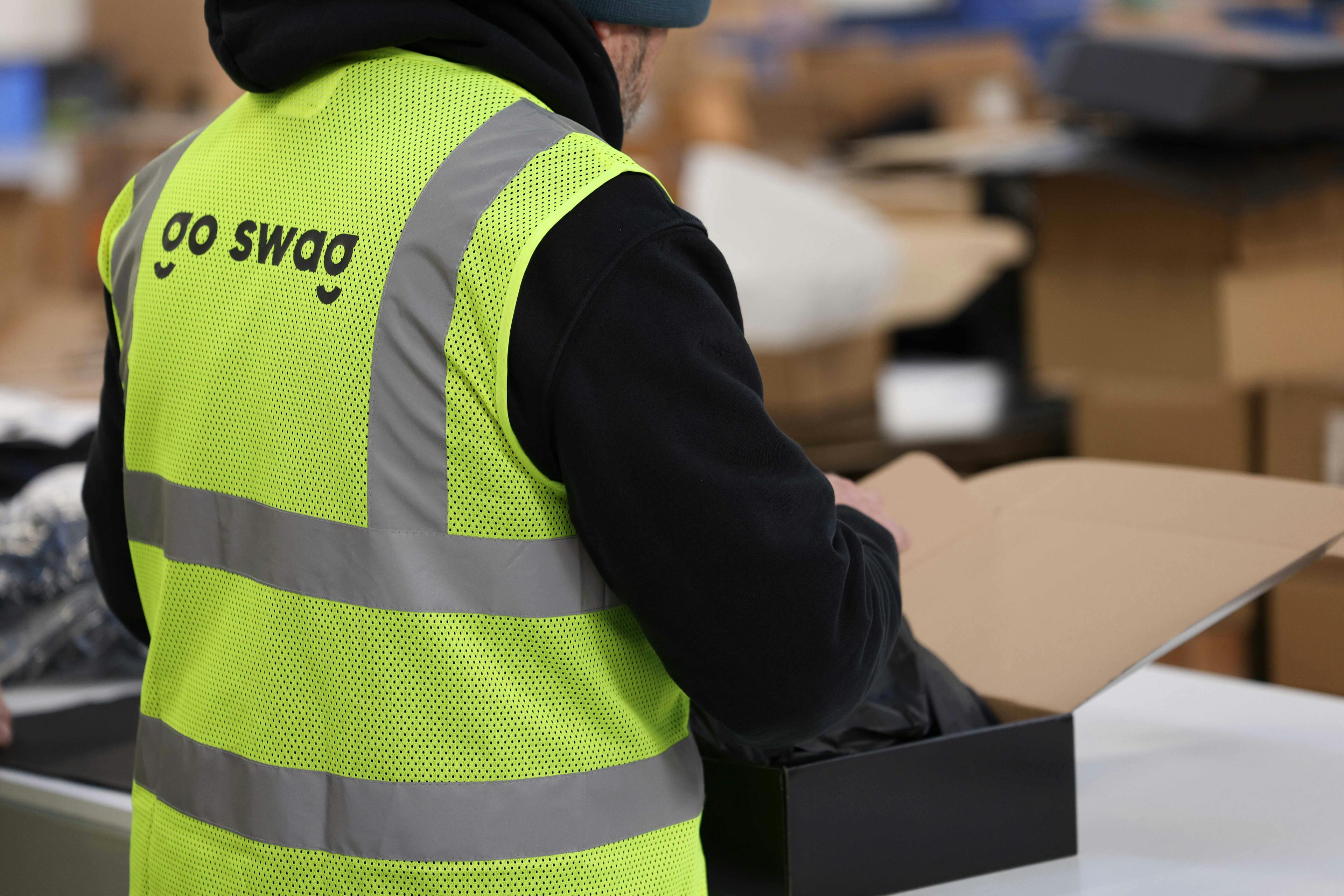 Photograph of a warehouse worker with a pack
