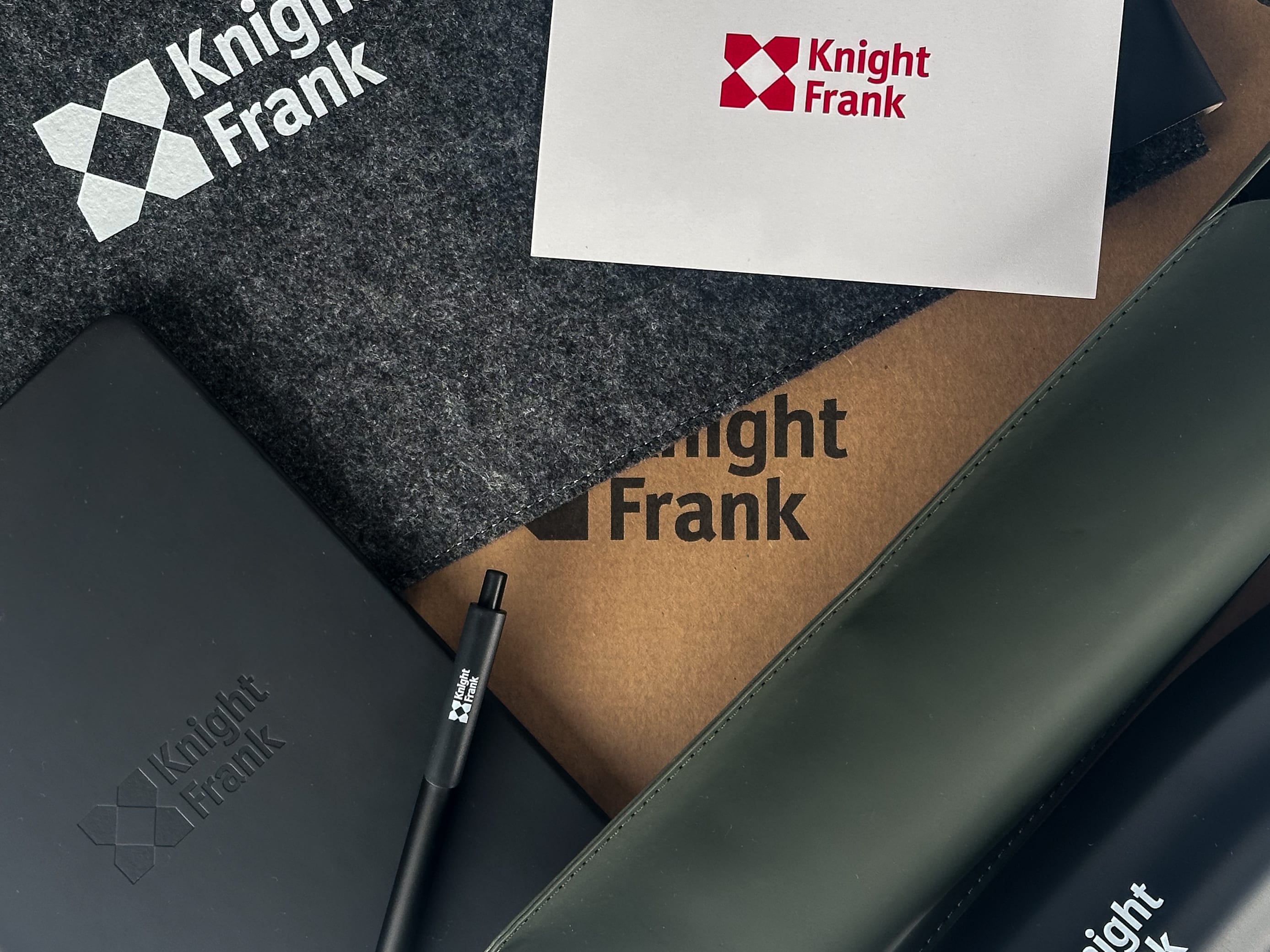 Knight Frank felt laptop sleeve, card, kraft box, debossed notebook, pen and leather sleeve.